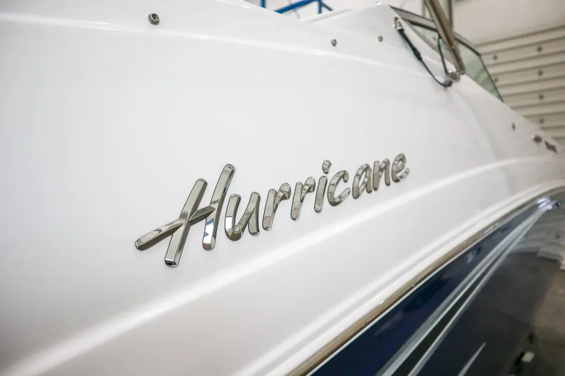 Slide: The Image of 2024 Hurricane SunDeck 2486 OB boat side view with logo. - 23