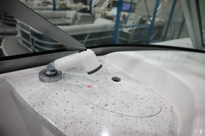 Slide: The Image of Close-up of the 2024 Hurricane SunDeck 2486 OB boat's sink area. - 26