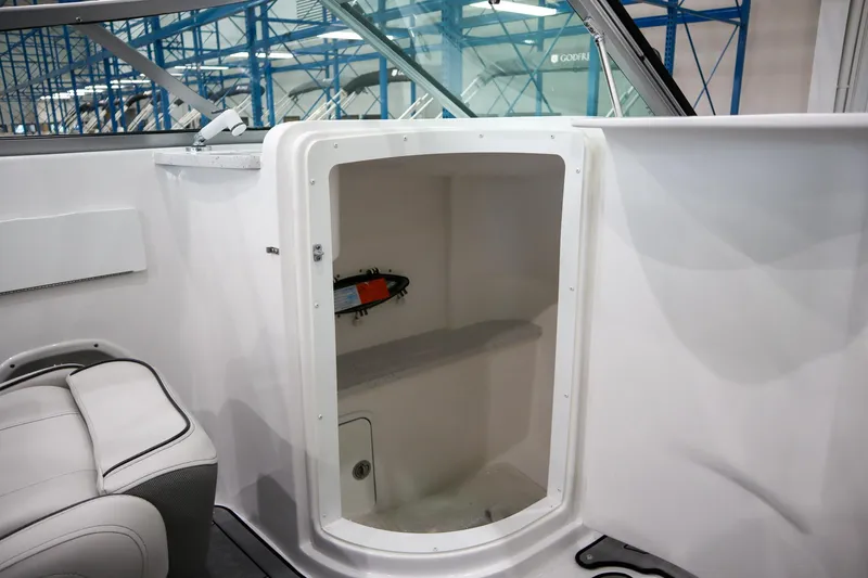 Slide: The Image of 2024 Hurricane SunDeck 2486 OB boat interior storage compartment. - 27