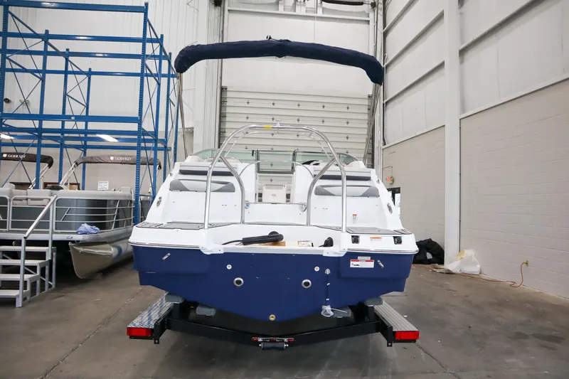 Slide: The Image of 2024 Hurricane SunDeck 2486 OB boat in indoor storage facility. - 3