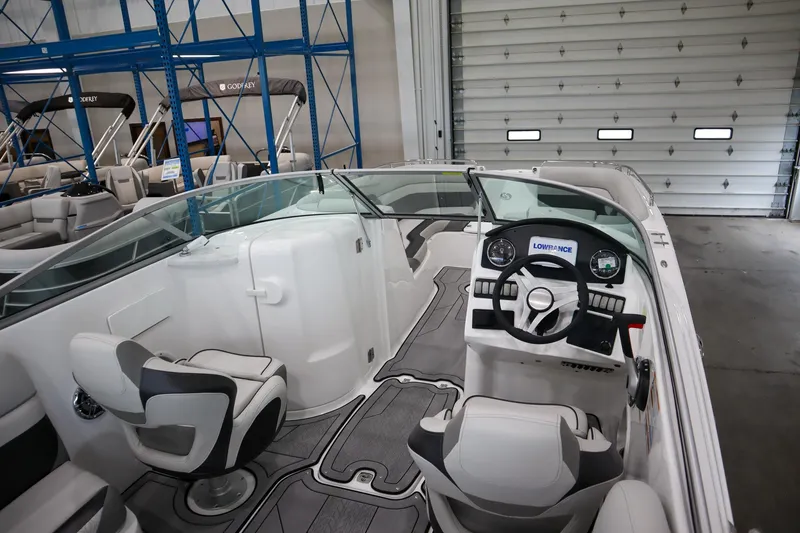 Slide: The Image of 2024 Hurricane SunDeck 2486 OB boat interior with modern helm and seating. - 4