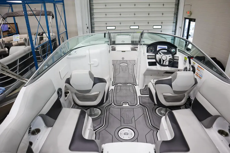 Slide: The Image of 2024 Hurricane SunDeck 2486 OB interior with seating and helm station. - 5