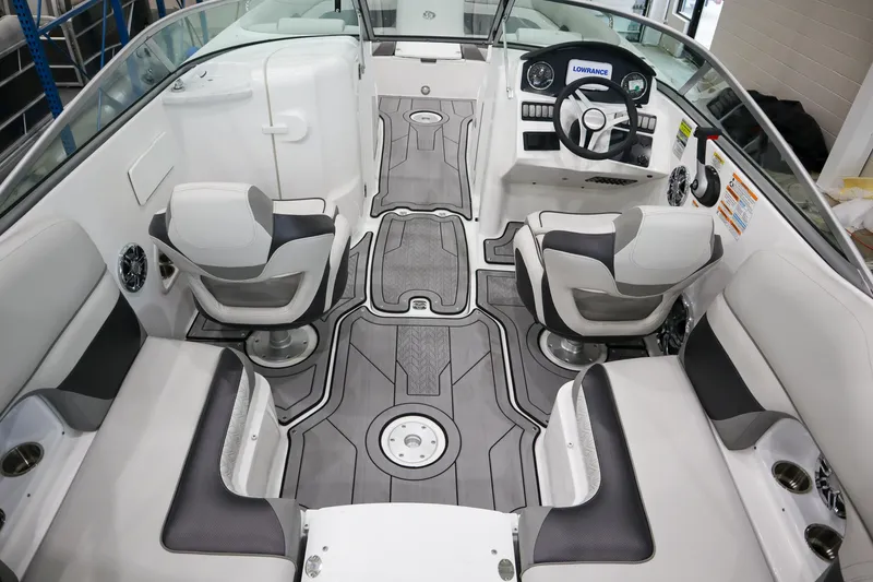Slide: The Image of 2024 Hurricane SunDeck 2486 OB interior with modern seating and steering console. - 6