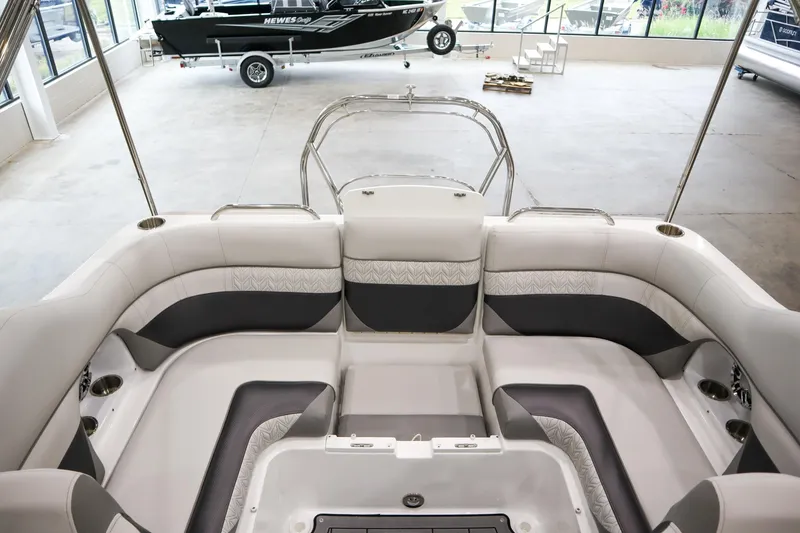Slide: The Image of 2024 Hurricane SunDeck 2486 OB boat interior with spacious seating. - 7