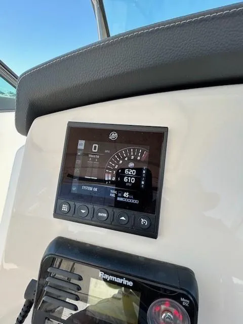 Slide: The Image of 2018 Boston Whaler 270 Vantage dashboard with Raymarine display and engine controls. - 11