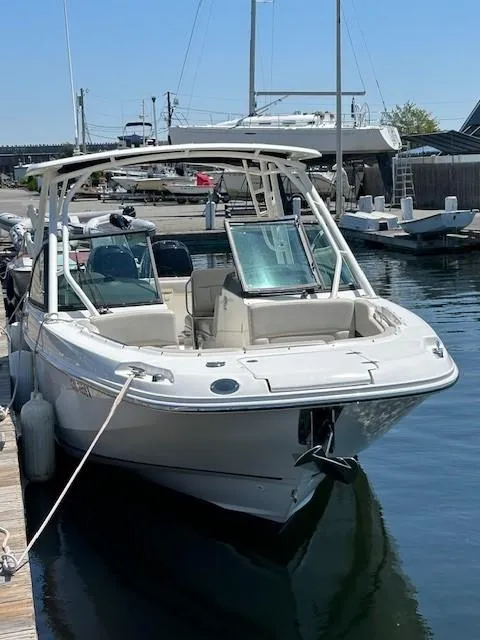Slide: The Image of 2018 Boston Whaler 270 Vantage docked at a marina. - 3