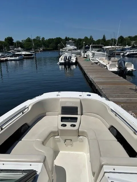 Slide: The Image of 2018 Boston Whaler 270 Vantage docked at a marina. - 6