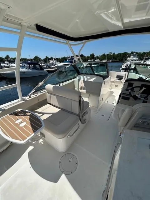 Slide: The Image of 2018 Boston Whaler 270 Vantage boat interior with seating and table. - 7