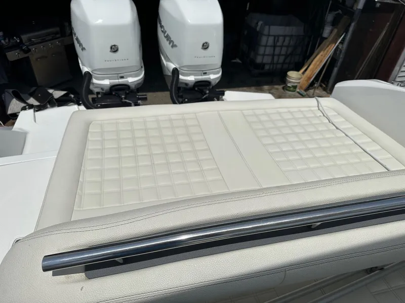 Slide: The Image of Cobalt 30SC Outboard 2021 boat with twin Mercury engines and cushioned seating. - 11