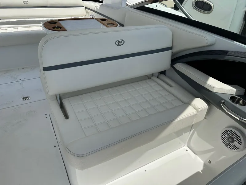 Slide: The Image of 2021 Cobalt 30SC Outboard boat interior with white cushioned seating. - 18