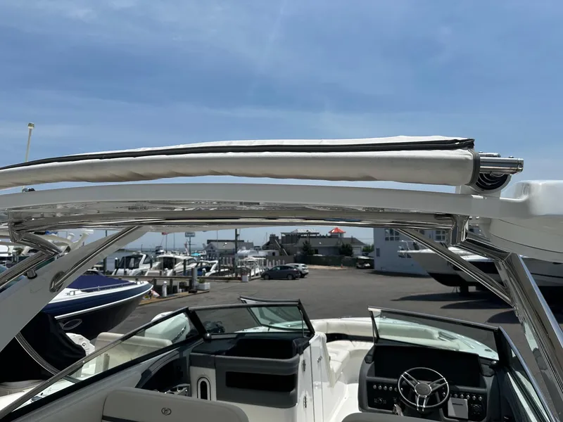 Slide: The Image of 2021 Cobalt 30SC Outboard boat with open cockpit and modern dashboard. - 26