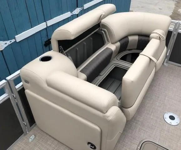 Slide: The Image of 2024 Sun Tracker Party Barge 22 XP3 interior seating with storage compartments. - 12