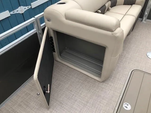 Slide: The Image of 2024 Sun Tracker Party Barge 22 XP3 storage compartment and seating area. - 13