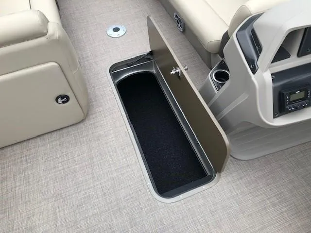 Slide: The Image of 2024 Sun Tracker Party Barge 22 XP3 storage compartment open on boat deck. - 15
