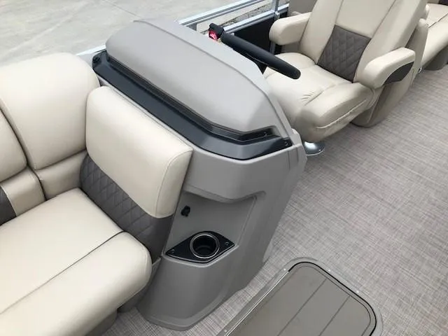 Slide: The Image of 2024 Sun Tracker Party Barge 22 XP3 interior with beige seating and helm station. - 18