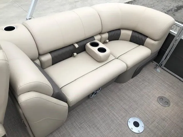 Slide: The Image of 2024 Sun Tracker Party Barge 22 XP3 beige seating with cup holders. - 27
