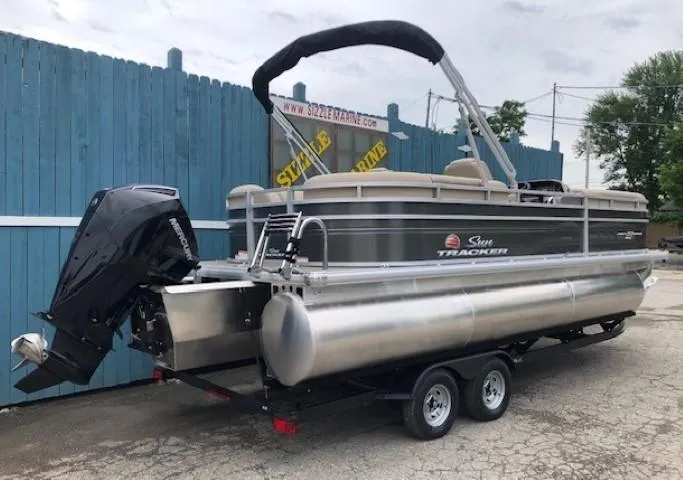 Slide: The Image of 2024 Sun Tracker Party Barge 22 XP3 pontoon boat on trailer, side view. - 4