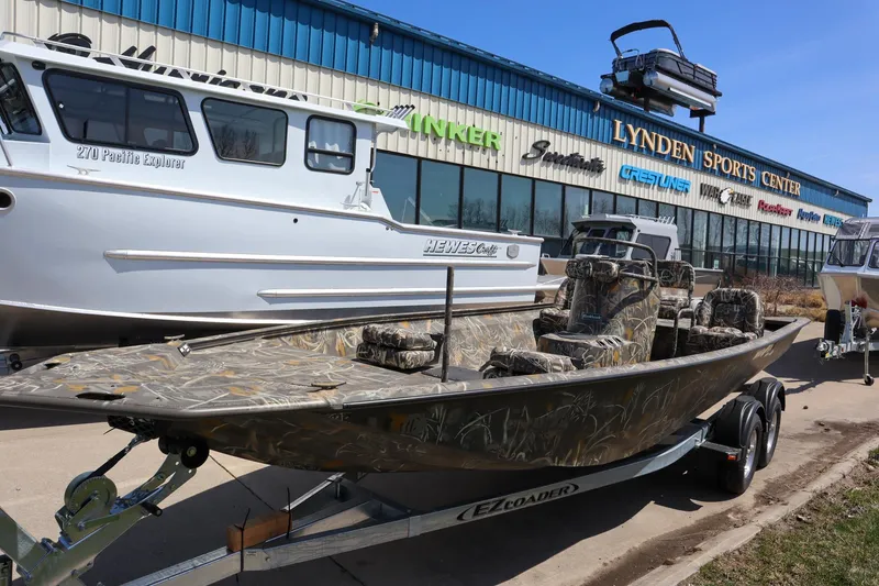 Slide: The Image of 2024 War Eagle 2170 Blackhawk boat on trailer at Lynden Sports Center. - 2