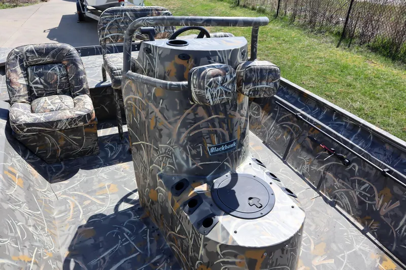 Slide: The Image of 2024 War Eagle 2170 Blackhawk boat with camo interior and console. - 20