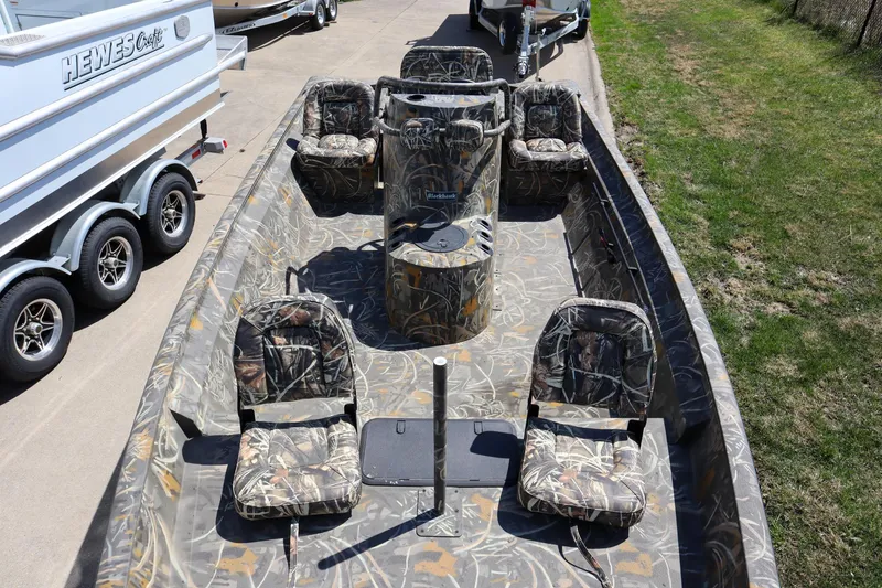 Slide: The Image of 2024 War Eagle 2170 Blackhawk boat with camo seats and console. - 3