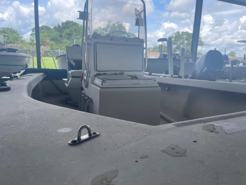 Slide: The Image of Alt text: 1997 Custom C Halk 18 boat interior with console and seating under a cloudy sky. - 3