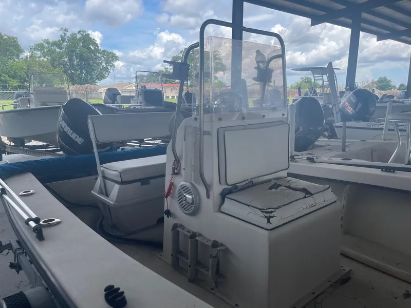 Slide: The Image of Custom 1997 C Halk 18 boat with center console under a covered dock. - 4