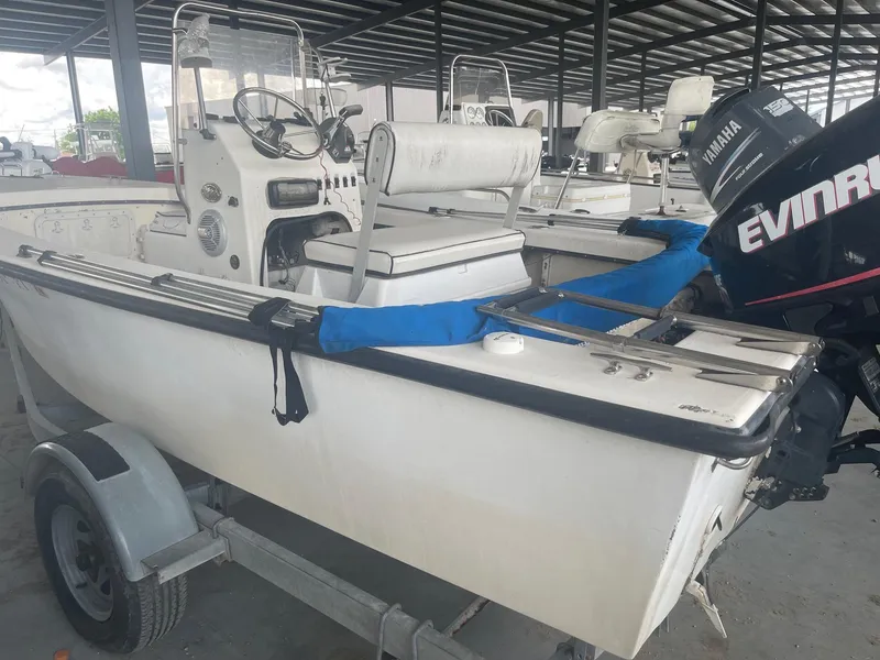 Slide: The Image of Custom 1997 C Halk 18 boat with Yamaha and Evinrude outboard motors in storage. - 6