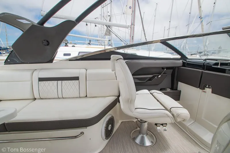 Slide: The Image of 2017 Sea Ray SLX 280 interior with white seating and modern design. - 14