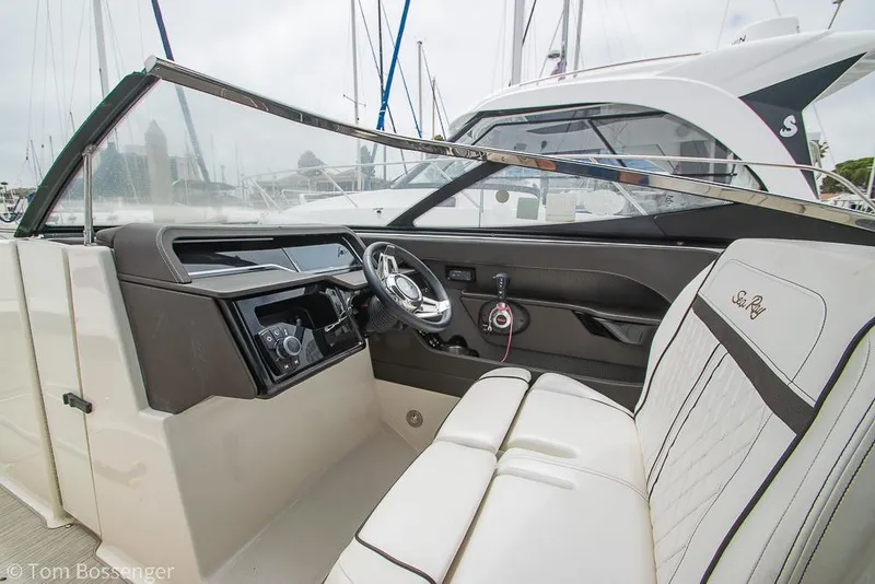 Slide: The Image of 2017 Sea Ray SLX 280 boat interior with steering wheel and seating. - 15