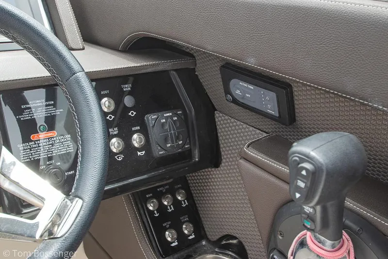 Slide: The Image of 2017 Sea Ray SLX 280 dashboard with steering wheel and control panel. - 17