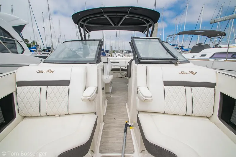 Slide: The Image of 2017 Sea Ray SLX 280 boat interior with white seating and open cockpit. - 23