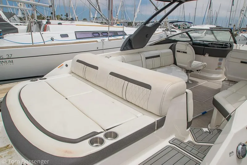 Slide: The Image of 2017 Sea Ray SLX 280 boat with spacious seating at a marina. - 8