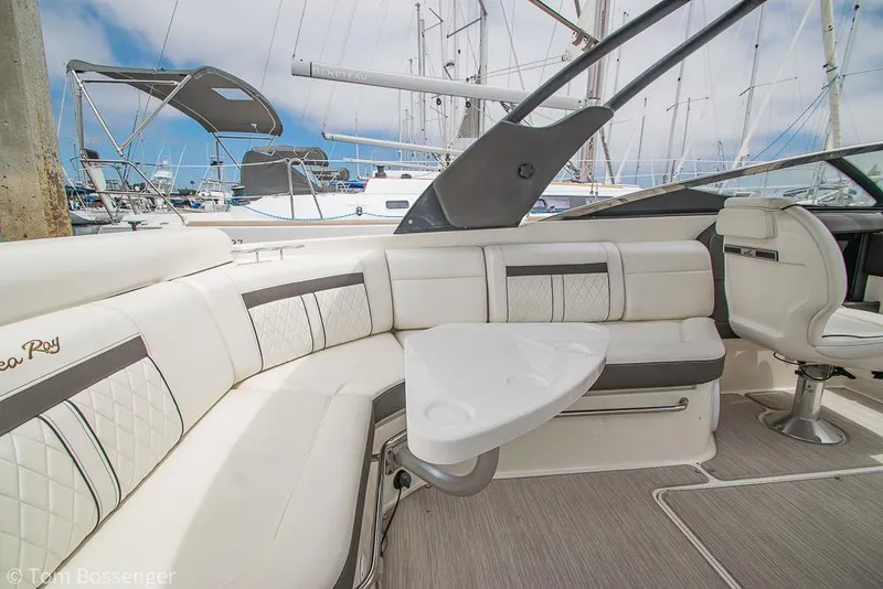 Slide: The Image of Luxurious 2017 Sea Ray SLX 280 boat interior with plush seating and table. - 9