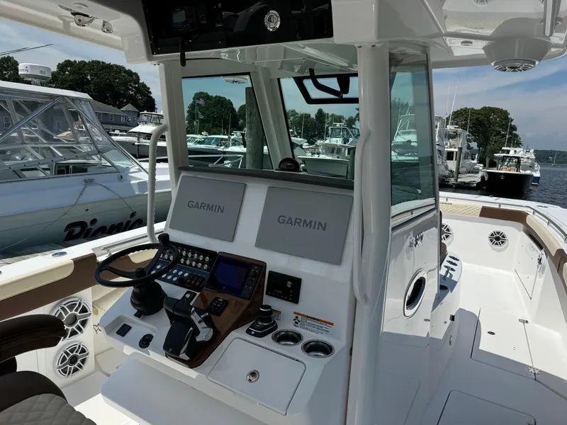 Slide: The Image of 2024 Caymas 34 CT boat cockpit with Garmin navigation system. - 15