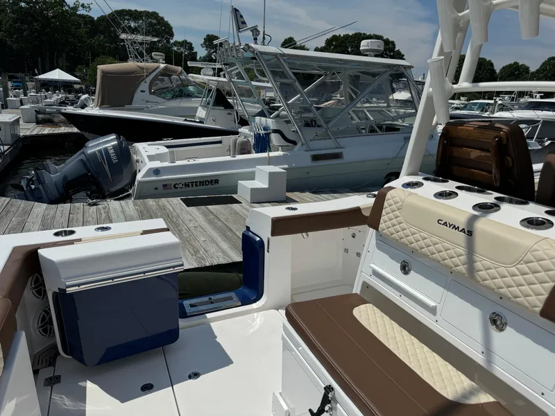 Slide: The Image of 2024 Caymas 34 CT boat docked at a marina with other boats. - 4