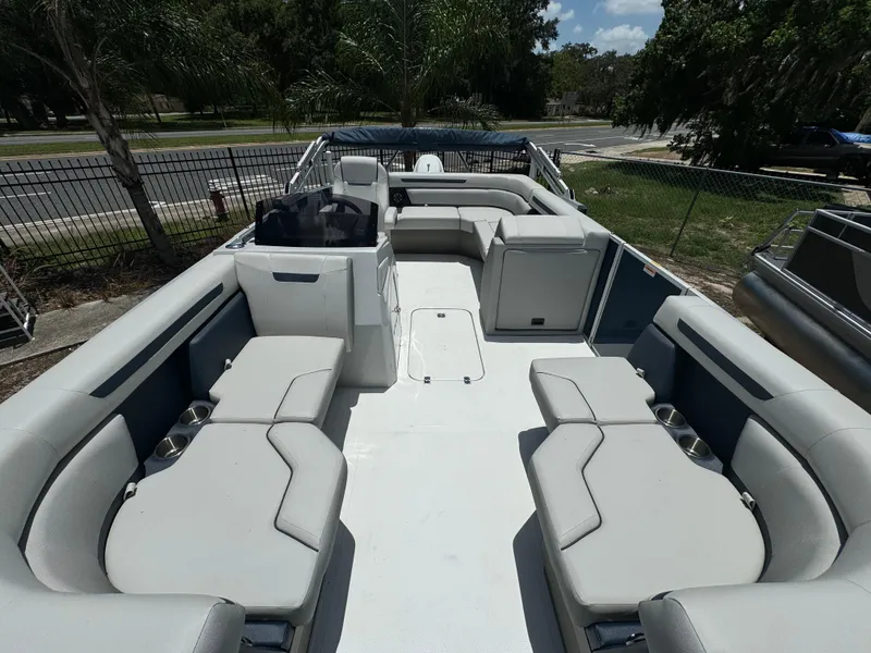 Slide: The Image of 2024 Hurricane FunDeck 2260 REF boat with spacious seating and modern design. - 3