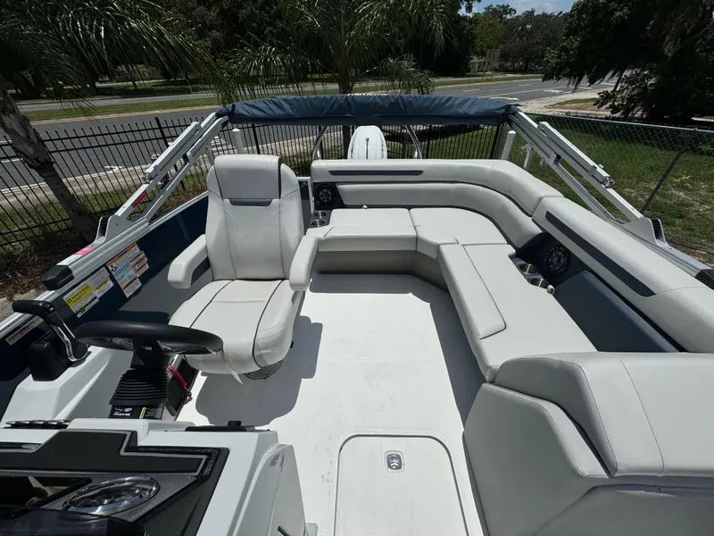 Slide: The Image of 2024 Hurricane FunDeck 2260 REF boat interior with spacious seating and modern design. - 4