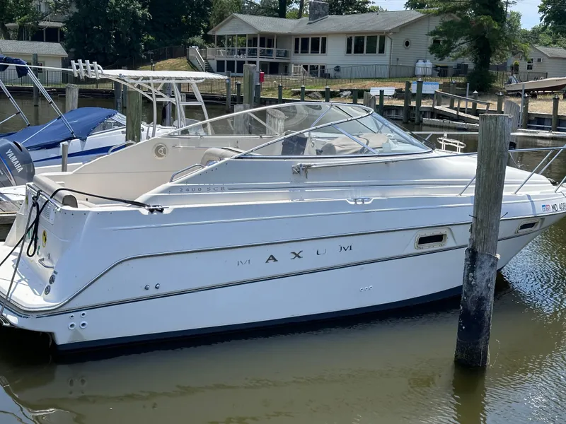 The Image of 1996 Maxum 2400 SCR boat docked at a marina. - 0