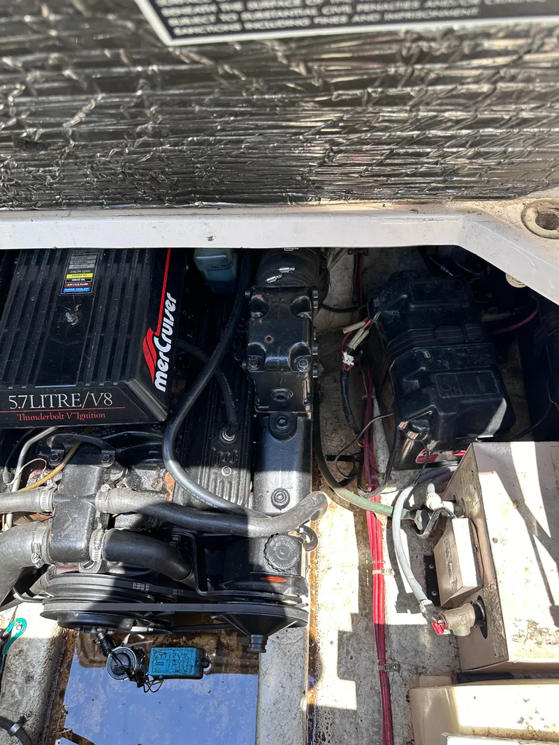 Slide: The Image of Engine compartment of a 1996 Maxum 2400 SCR boat with a 5.7L V8 MerCruiser engine. - 18