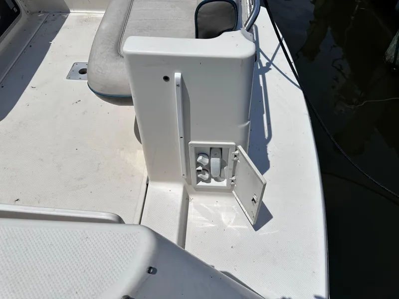 Slide: The Image of 1996 Maxum 2400 SCR boat deck with open storage compartment. - 21