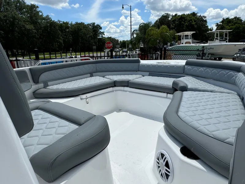 Slide: The Image of 2024 NauticStar 211 Hybrid boat with spacious seating and modern design. - 4