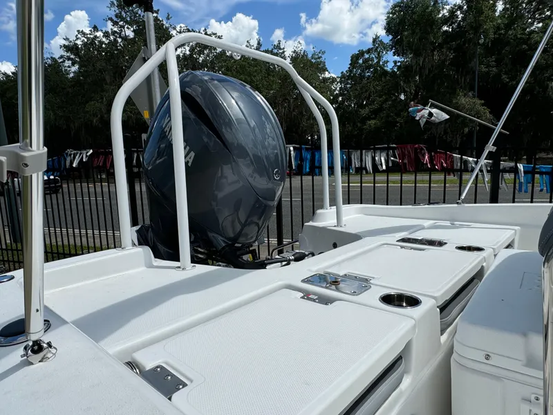 Slide: The Image of 2024 NauticStar 211 Hybrid boat with Yamaha outboard motor. - 5