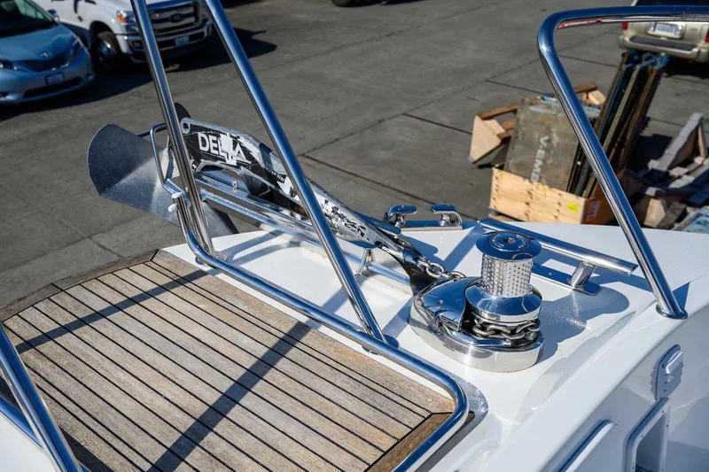 Slide: The Image of 2023 Targa 46 boat anchor system with stainless steel fittings and wooden deck. - 12