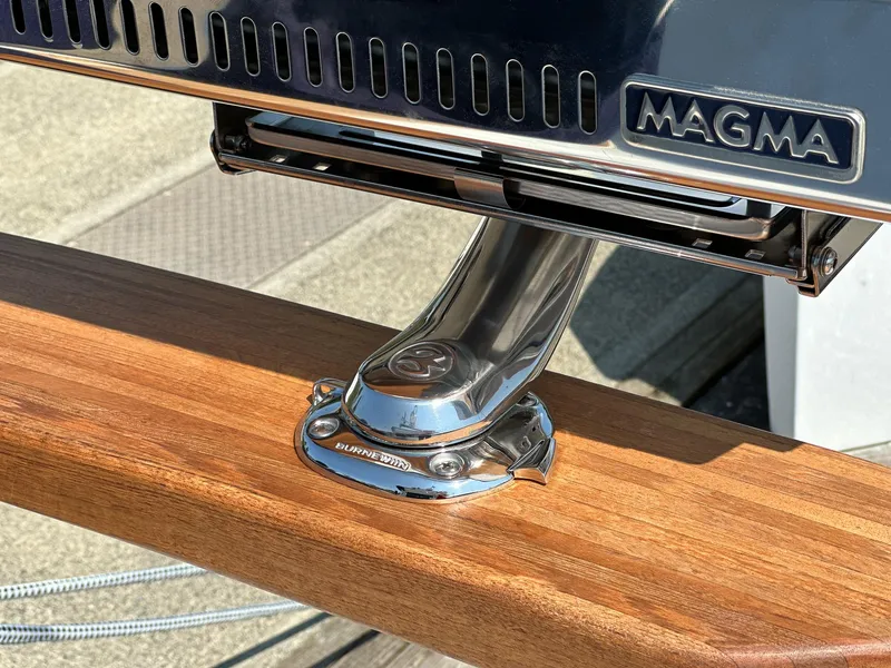 Slide: The Image of Stainless steel Magma grill mounted on Targa 46 yacht's wooden rail, 2023 model. - 17