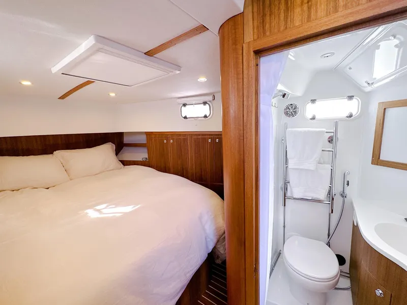 Slide: The Image of Luxurious cabin interior of 2023 Targa 46 yacht with cozy bed and modern bathroom. - 32
