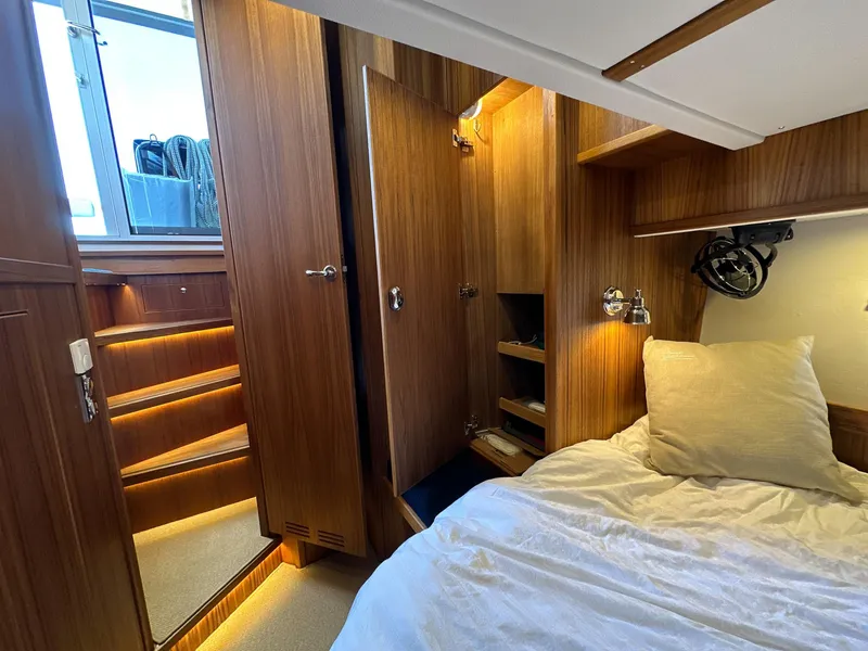 Slide: The Image of Luxurious cabin interior of 2023 Targa 46 yacht with wooden finish and cozy bedding. - 37