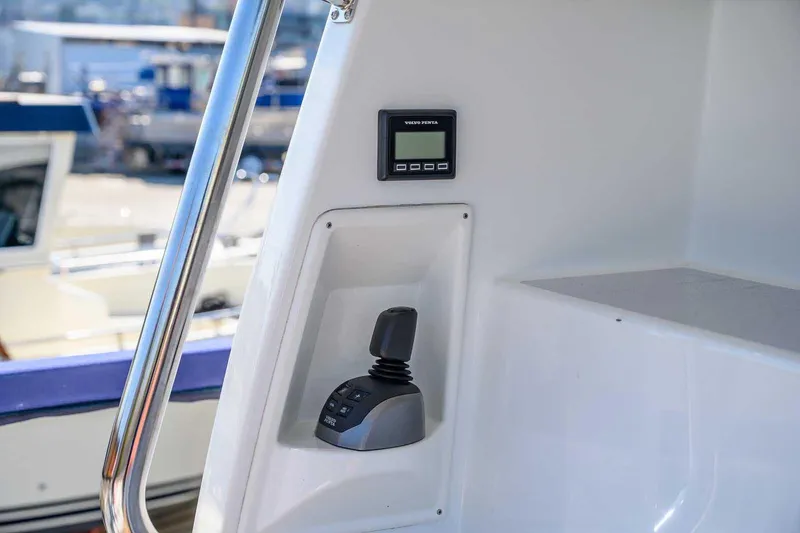 Slide: The Image of Control panel and joystick on 2023 Targa 46 boat, featuring Volvo Penta display. - 4
