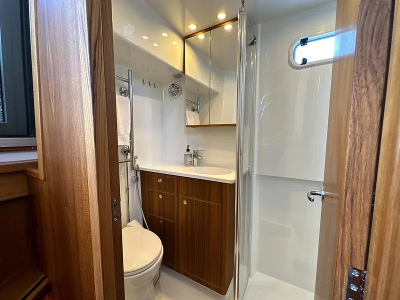 Slide: The Image of Luxurious bathroom in 2023 Targa 46 yacht with wood accents and modern fixtures. - 40