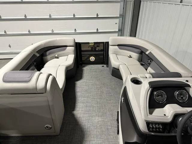 Slide: The Image of 2025 Barletta Cabrio C22UC boat interior with steering console and captain's chair. - 10