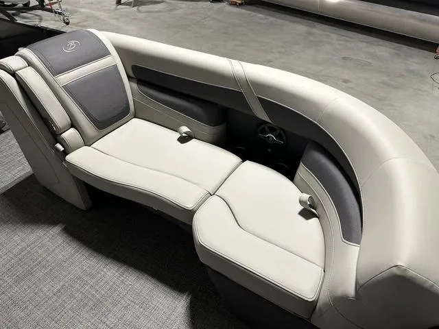Slide: The Image of 2025 Barletta Cabrio C22UC boat interior with plush seating and modern design. - 13